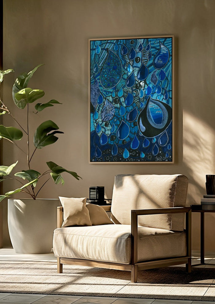 Blue Raindrops by JHN.ByHjort framed above a beige armchair beside a potted plant