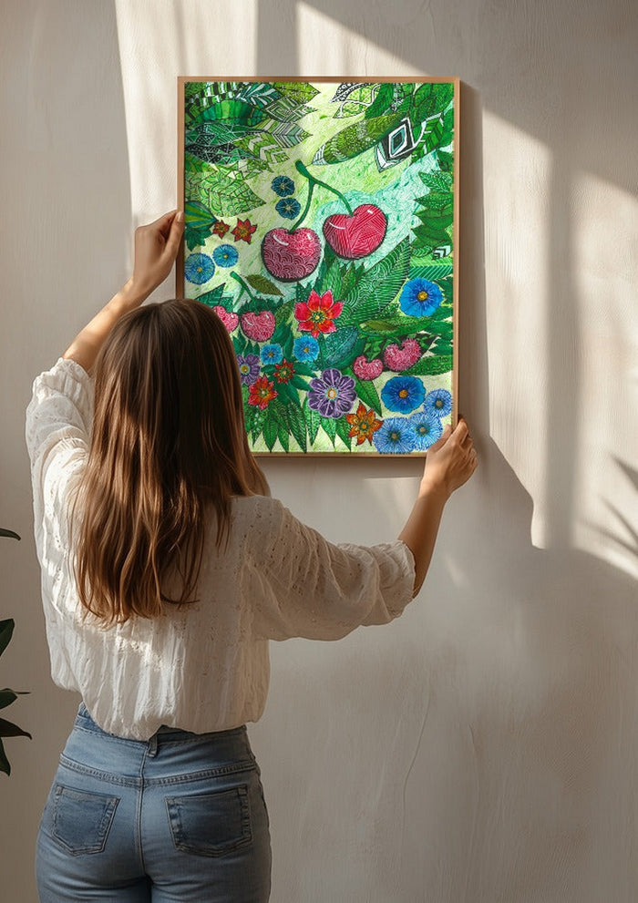 Cherries and Blue Flowers by JHN.ByHjort being hung on a sunlit wall