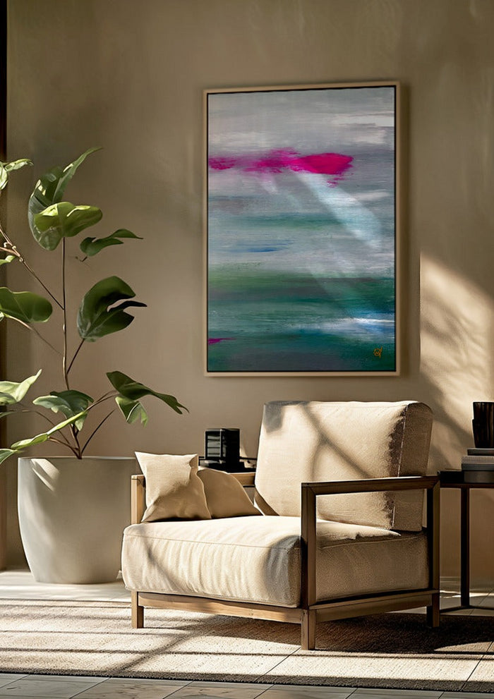 Scarlet sunset 2 by Marina Agre framed above a beige armchair beside a potted plant