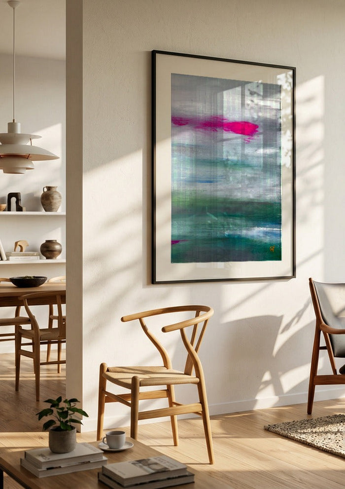 Scarlet sunset 2 by Marina Agre in a black frame in a bright dining room with wooden chairs