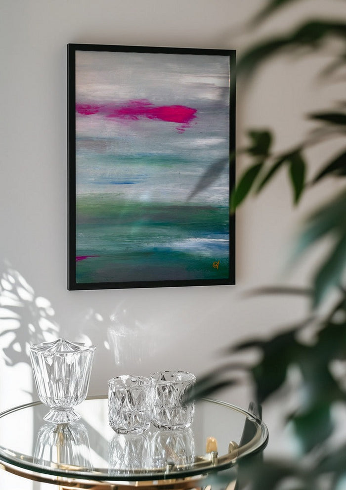 Scarlet sunset 2 by Marina Agre in a black frame above a glass table with crystal glassware