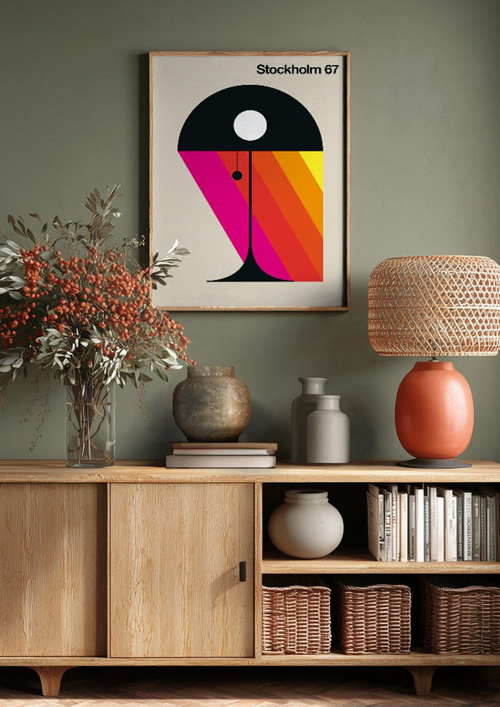 Stockholm 67 by Bo Lundberg above a wooden sideboard on a sage green wall