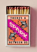 There's a Spark by Daniel Leo — vintage matchbox poster with two engraved sharks and a magenta lightning bolt