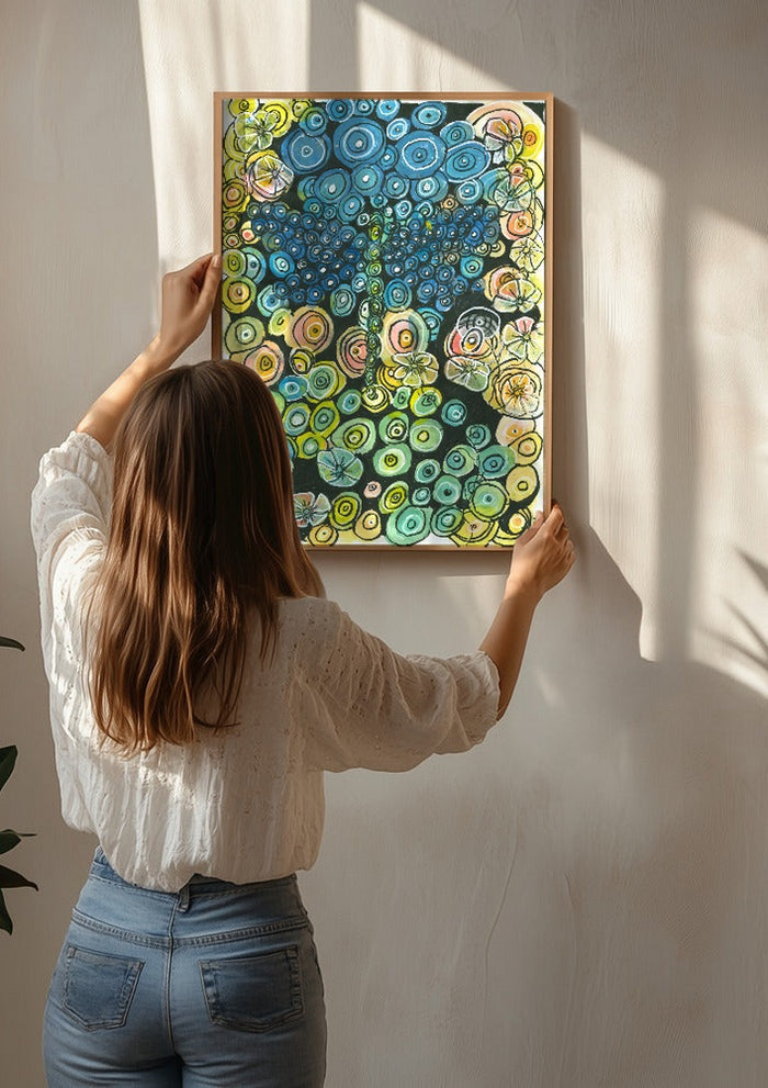 Tree of Circles by JHN.ByHjort being hung on a sunlit wall