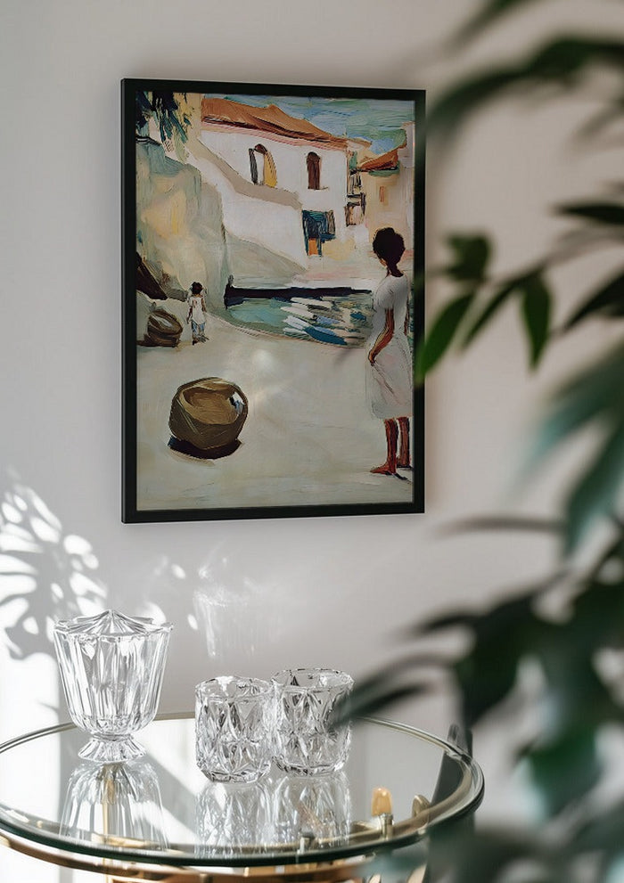 Village Street by Elena Avanesova in a black frame above a glass table with crystal glassware