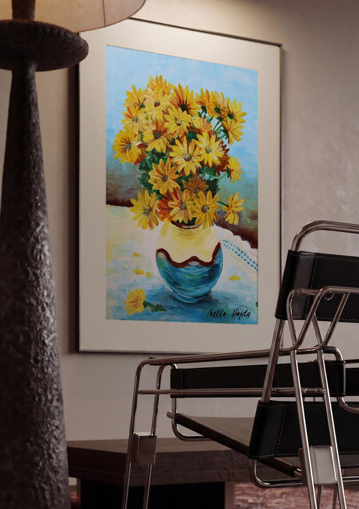 Yellow flowers by Nella Hajdu framed in a dim room beside a tubular steel chair