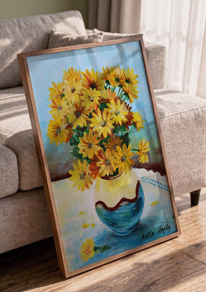 Yellow flowers by Nella Hajdu in a walnut frame leaning against a grey sofa